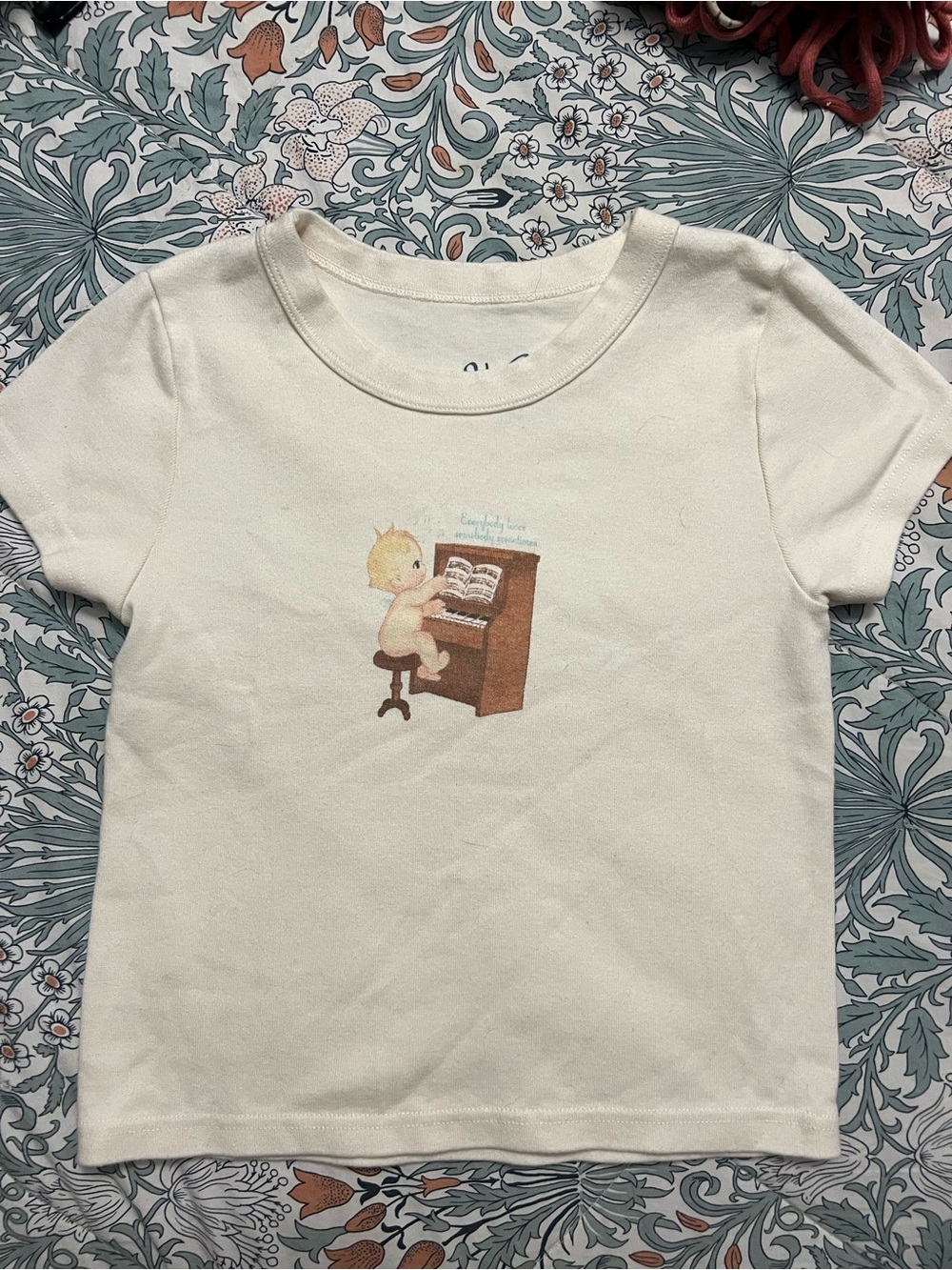 Brandy Melville Cream Tee with Baby Piano Graphic